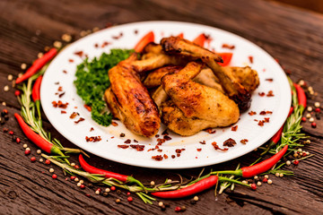 Chicken wings grilled with spices and chili pepper