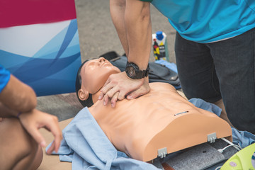 Demonstration of CPR with rubber puppets is a teaching method to press the chest to teach life...