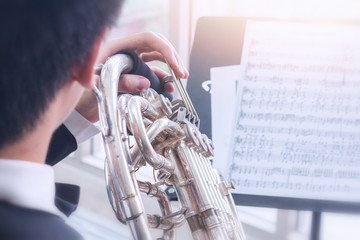Closeup musician is playing Trumpet practice for show in orchestra, musician practice concept