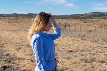 A blonde girl in the desert