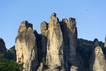 Fototapeta premium rocks against the blue sky and the bird