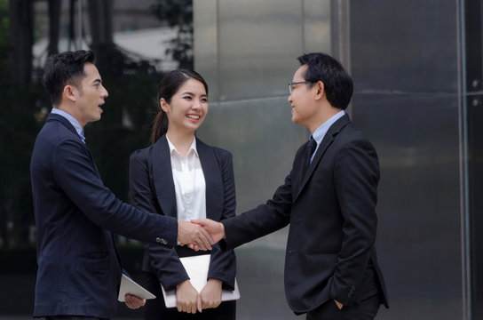 Deal. asian business people team handshake after finishing up new project plan business meeting in the modern city, congratulation, success, meeting, partner, teamwork, community, connection concept
