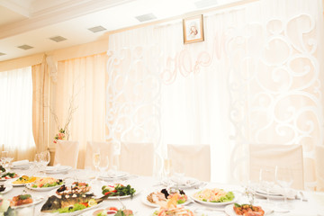 Interior of a restaurant prepared for wedding ceremony