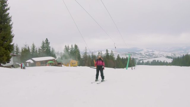 Young girl skiing on a ski lift on mount, in Transcarpathia.  Shooting on action camera