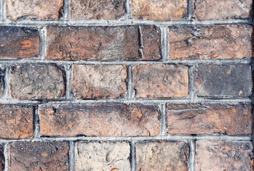 Red gray brick wall background close up  