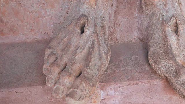 statue with stigmata on feet