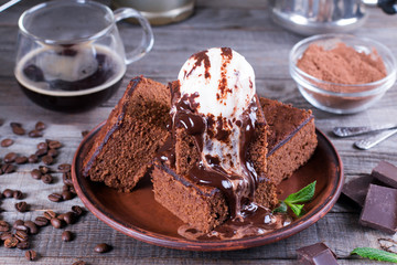 Chocolate cake with ice cream and chocolate sauce