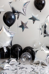 silver with black baby birthday decoration with stars and balls