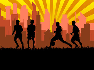 silhouette of group soccer player in city background