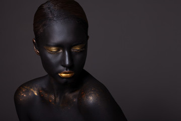 Portrait of a beautiful girl with creative, fantasy make-up.