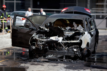 Burned car, burned-out car body, broken vehicle