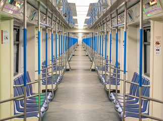 modern subway train metro car from inside with comfortable seats for passengers