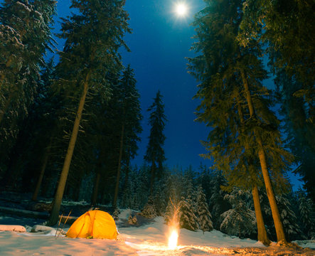 winter camping with fire at night