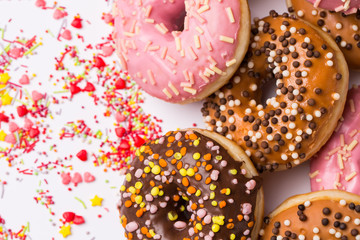 homemade donuts with chocolate and icing glaze on white background