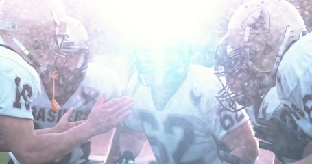 American football players in stadium during game - Powered by Adobe