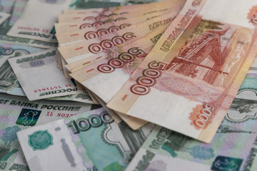 Fototapeta na wymiar Russian money. Fan of banknotes 1000 rubles, 5000 rubles