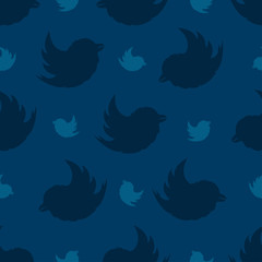 Obraz na płótnie Canvas Seamless pattern from birds on a navy blue background. The Bullfinch Pattern