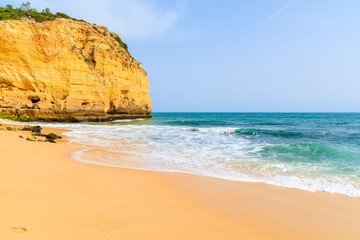 Sea waves on sandy Val Centianes beach, Algarve region, Portugal