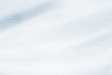 Fresh snow background texture. Winter background with snowflakes and snow mounds.