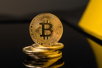 Bitcoin blockchain  BTC concept. Golden Bitcoin coins as symbol of electronic virtual money