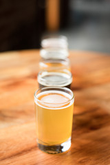 Pale ale with a flight of beer arranged in a straight row