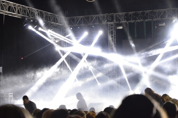The spotlights aimed at the stage during the performance.