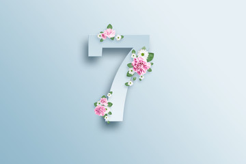 Digit seven, pink roses and green leaves on a light background. Spring background. flat lay, copy space, Mixed media, top view.