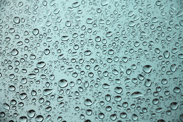 Turquoise background with small rain drops