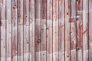 Textured background of vertical wooden boards, gray and brown.