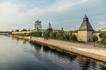 Ancient Pskov Kremlin on river bank, Trinity church, day time