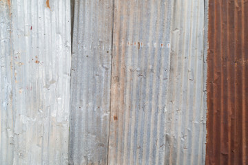 Rusty and corrugated iron metal construction site wall texture background.