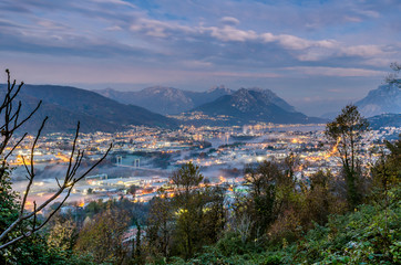 The town is waking up. A panorama on the Adda river at the sunrise. Picture taken from Monte Marenzo