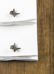 cufflinks on the white and black background