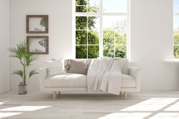 Idea of white room with sofa and summer landscape in window. Scandinavian interior design. 3D illustration
