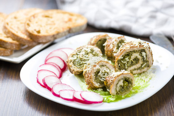 pork roulades stuffed with spinach sprinkled with freshly grated horseradish
