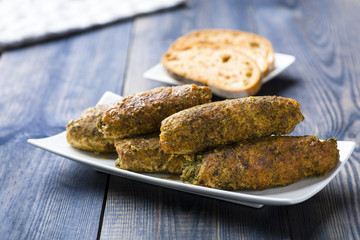 pork roulades stuffed with spinach sprinkled with freshly grated horseradish