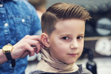 European boy in a barber shop. Ready look. © Artem