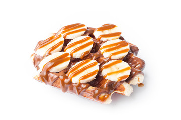 Belgian waffles with banana on white background