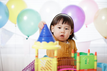 baby girl play toy at home