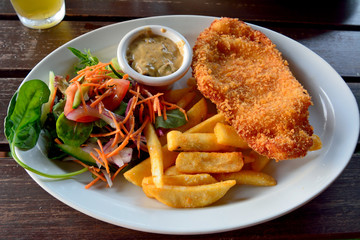 Schnitzel with salad and french fries
