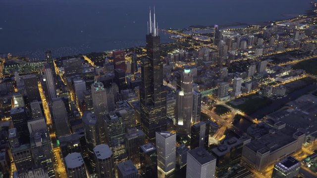 Chicago aerial view orbiting Willis Tower and the Chicago Loop at dusk