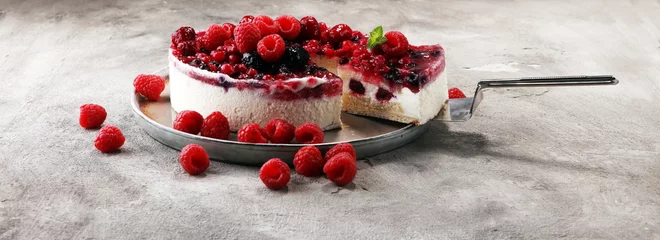 Gardinen raspberry cake and many fresh raspberries © beats_