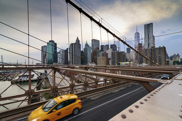 Fototapeta na wymiar Traffic crossing the Brooklyn Bridge in New York City