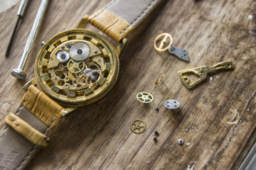 Watchmaker is repairing the mechanical watches in his workshop