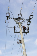 Conductive insulators on concrete column.