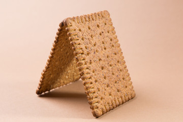tent or bungalow of cookies on a brown background
