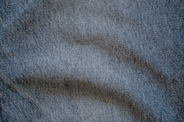 Texture of old denim or blue jeans background