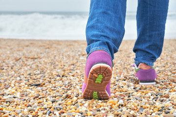 Woman Walking on the beach.