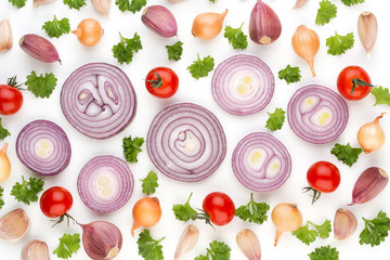 Onion and spices isolated on white background, top view. Wallpaper abstract composition of vegetables.