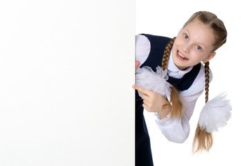 Little girl is showing a finger on a white banner.